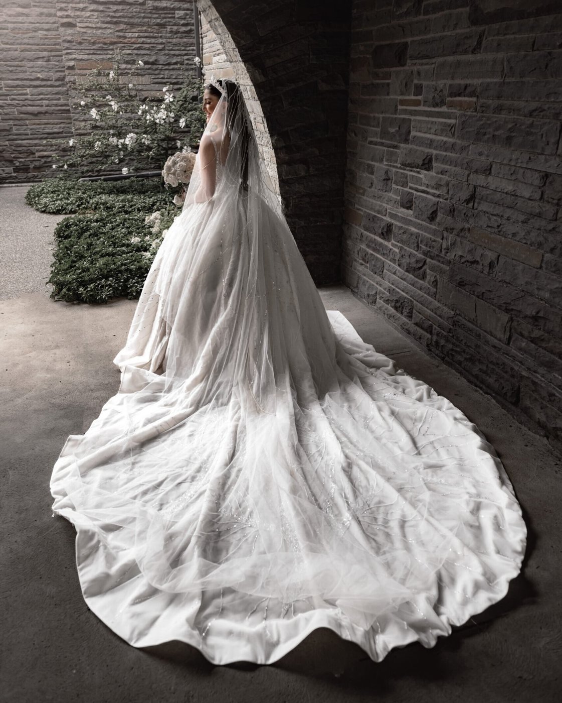 Editorial bridal portrait in a brick archway