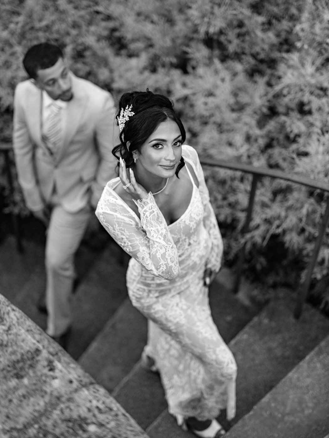 Couple on a stone staircase, black and white